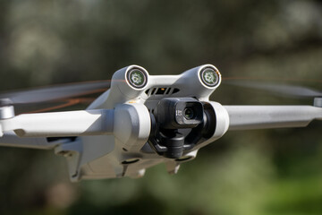 Drone with forward facing lidar and high definition camera flying in the air close up - obrazy, fototapety, plakaty