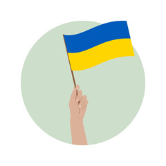 Uniesiona ręka z flagą Ukrainy na zielonym tle. Wsparcie dla Ukrainy. "Nie" dla wojny. Nadzieja i modlitwa o pokój.