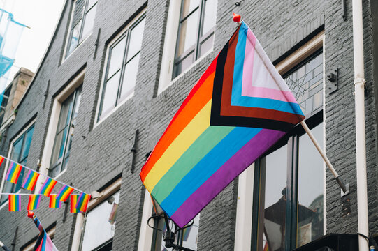 Modern progress LGBTQ pride flag during pride month. Includes people of color. Rainbow gay, transgender and queer symbol for equality. Celebration of pride month