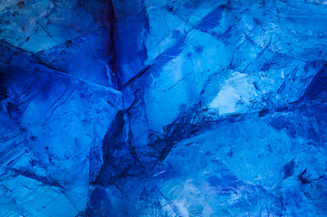 fluorite macro detail texture background. close-up raw unpolished blue semi-precious gemstone.