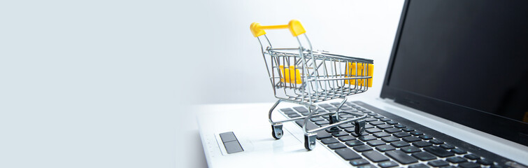 Laptop keyboard with supermarket trolley