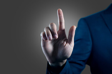 Businessman hand touching virtual screen