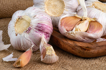 Slices and Whole bulb of garlic close up. Selective forus.