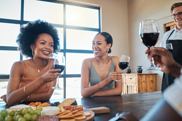 Happy, smile and friends drinking wine and eating healthy, fresh and organic meal with toasted bread on a food table together. Diversity, glass, and relaxed people laughing at a luxury dining party