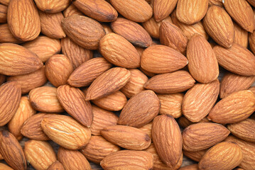 Almonds nuts on background, Close up delicious sweet almonds top view, roasted almond nut for healthy food and snack