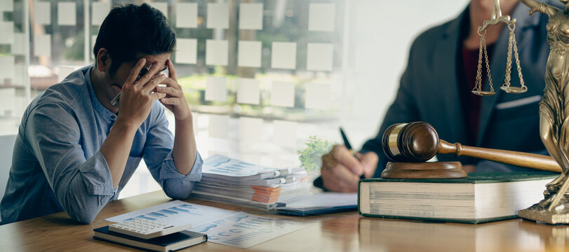 businessman meeting with lawyer Financial advisors discuss contract documents sitting at their desks. Legal concepts, advice, legal services.