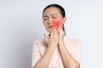 Asian woman was sick with toothache standing isolated on white background.