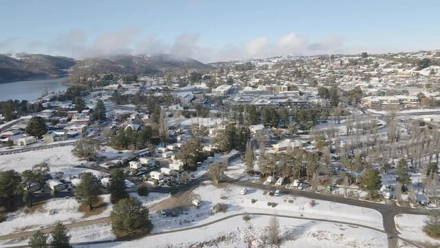 Panning drone shot of snow covered australian village