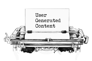 Concept words UGC user generated content typed on the old retro typewriter on a beautiful white background.