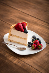 Charlotte with strawberries and blueberries french traditional dessert