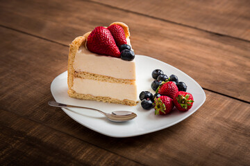 Charlotte with strawberries and blueberries french traditional dessert