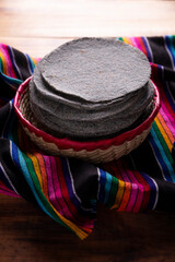 Blue Corn Tortillas. Food made with nixtamalized corn, a staple food in several American countries, an essential element in many Latin American dishes.