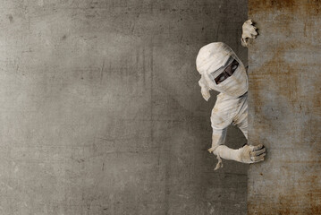 Mummy coming from behind the wall