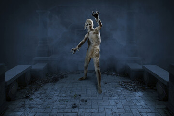 Mummy with a skull head and claw hands standing