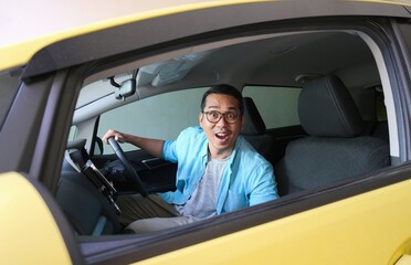 A car driver looking camera through passenger window with wow expression