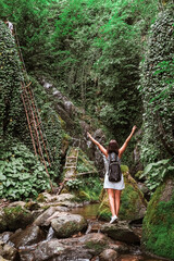 Travel. Girl travels through the mountains and waterfalls of wild nature. Unity, mental health, eco travel. Hiking in the mountains, van life vibes, travelling,good moments, digital detox