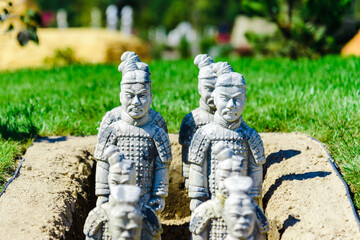 The Terracotta Army Miniature Sculpture on the green grass at summer day.