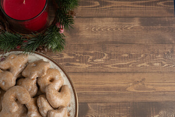 Assortment of Nuremberg Christmas Cookies on a Plate on a Wooden Table from Above with Selective Focus and Copy Space