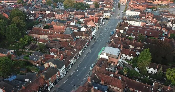 Rare drone shot of Henley on Thames high street at sunrise. The shot starts from the church and pans up the street to the town hall.