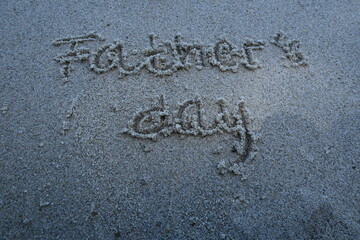 father's day writing on the beach sand

