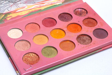 Mua and girly concept. Eyeshadow palette on white background.