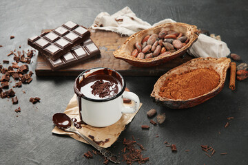 Melted chocolate drink on dark background.