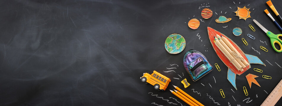 education. Back to school concept over blackboard background. top view, flat lay