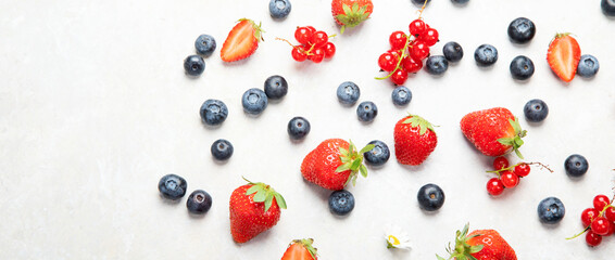 Naklejka na ściany i meble Various fresh berries on neutral background.
