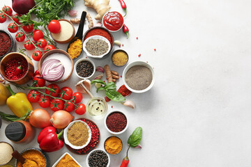 Composition with aromatic spices and vegetables on light background