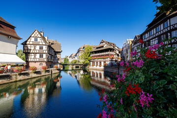 Fototapeta na wymiar Timber-framed houses at ill in La Petite France in Strasbourg in Alsace