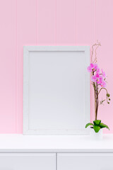 Picture frame mockup on a white cabinet. 3d rendered illustration.