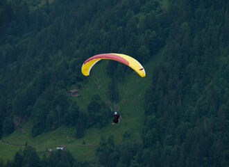 A picture with motion blur and noise effect of paragliding at Lauterbrunnen Valley