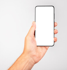 Hand holding smartphone in vertical position. Woman using for taking Selfie. Telephone template with white screen