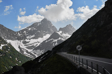 The road in the snowy Swiss Alps Mountains. Travel by Switzerland.