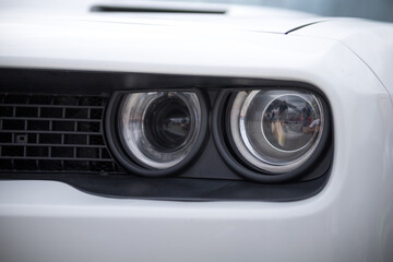 Obraz na płótnie Canvas headlight of a modern prestigious white car