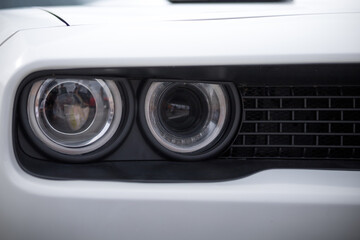 headlight of a modern prestigious white car