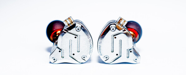 Pair of in-ear monitors without cable on an isolated white background