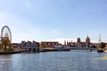 Fototapeta premium dansk, Old Town - historic buildings along the riverbank of Motlawa River, Poland