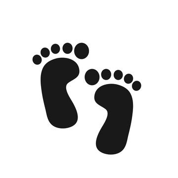 Baby footprints. Human feet standing on the ground. Isolated on white background.