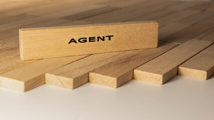 Agent written on wooden surface. Concept created from wooden sticks