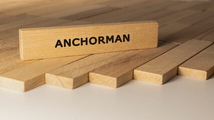 Anchorman written on wooden surface. Concept created from wooden sticks