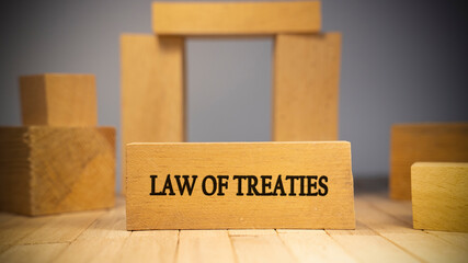 Law of treaties was written on the wooden surface. Law and state system. Concept created from wooden sticks