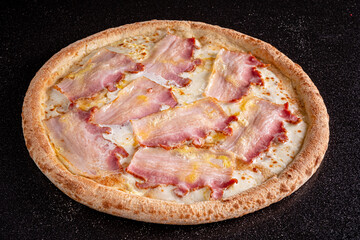 pizza with bacon on the black background