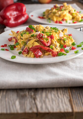Low carb breakfast with scrambled eggs and vegetables at home