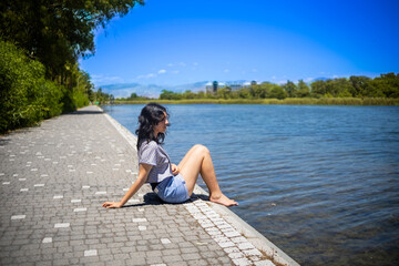 Young teen girl on the shore of Titreyen Gol lake in Turkey