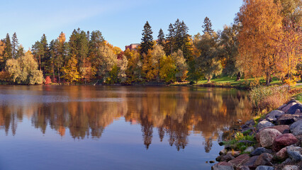 Northern European landscape in Finnish Kellokoski: golden autumn, rapids, Kerava river, sunny day,...