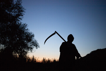 grim reaper, the death itself, scary horror shot of Grim Reaper holding scythe