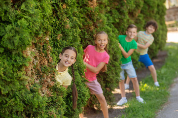 Girls and boys jumping out of bushes unexpectedly