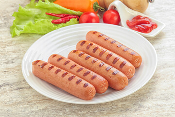 Grilled sausages with tomato sauce