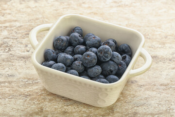 Sweet ripe blueberry heap in the bowl